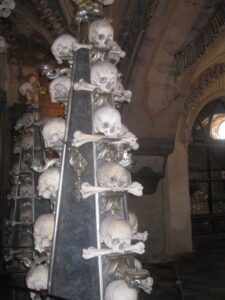 a group of skulls and bones on a pyramid