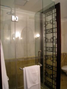 a bathroom with a glass shower door