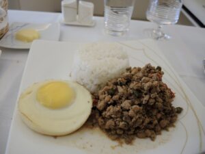 a plate of food with a egg and rice