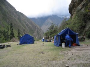 a group of people camping in a valley