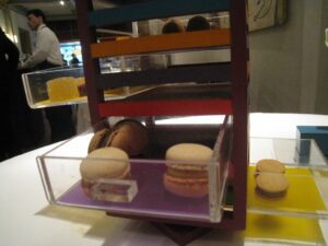 a display case with macaroons