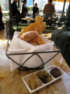 a basket of bread and some food