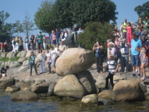 a group of people standing on rocks