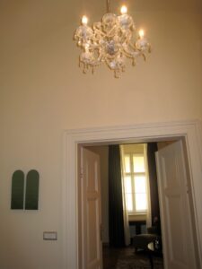 a chandelier above a doorway