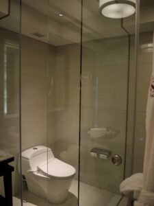 a bathroom with glass shower doors