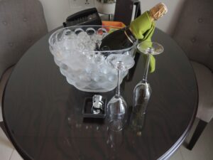 a champagne bottle in a bowl of ice