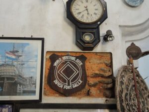 a clock and pictures on a wall