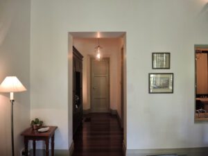 a hallway with a door and a table