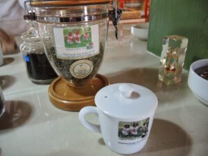 a tea cup and a jar on a counter