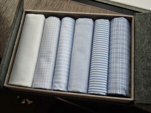 a box of folded shirts