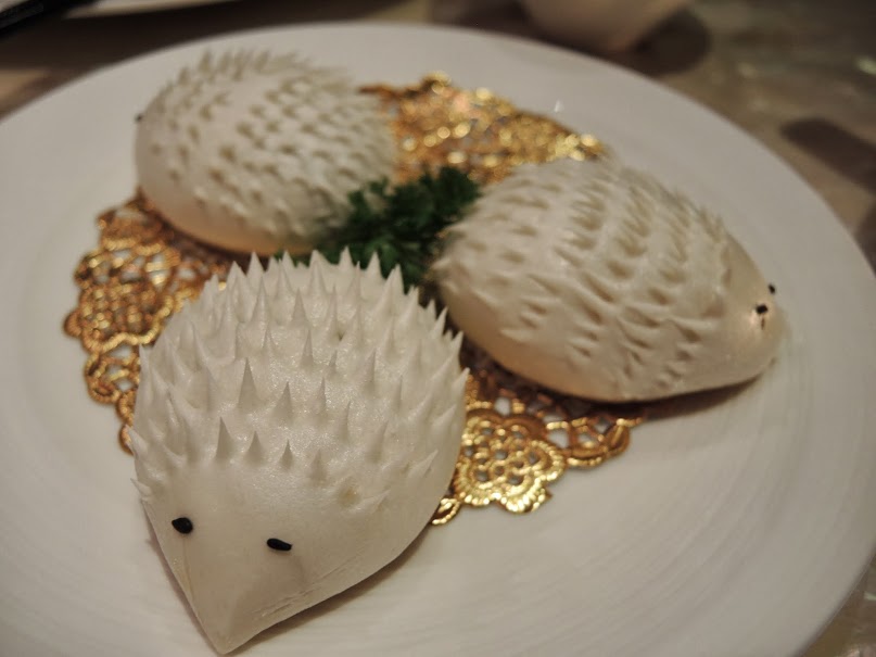 a plate of food with hedgehog shaped objects