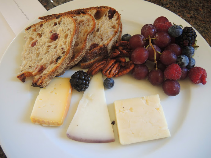 a plate of food with fruit and cheese