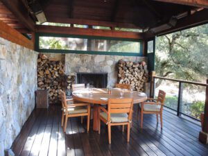 a table and chairs on a deck