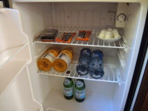 a refrigerator with drinks and beverages