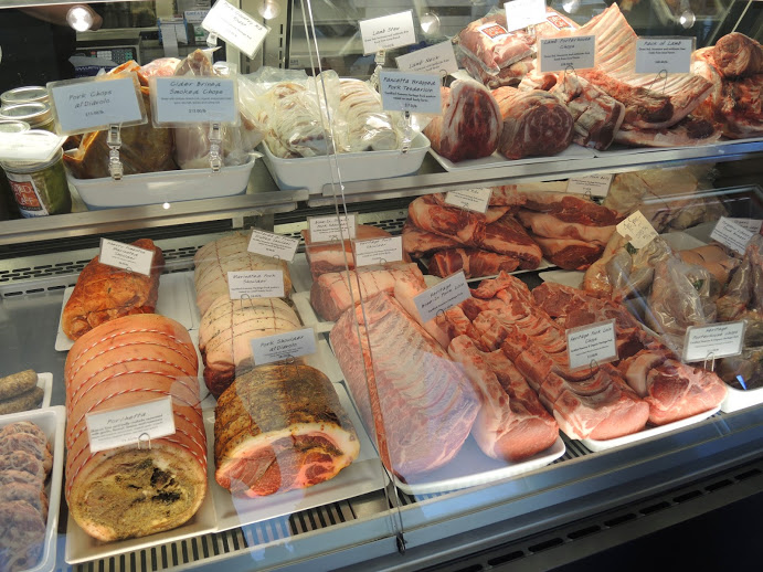 a display case with different types of meat