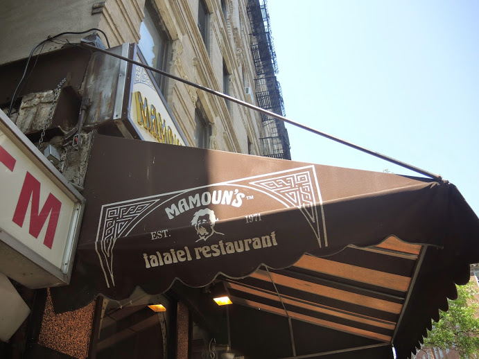 a brown awning with white text on it
