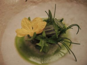 a plate of food with a flower on it