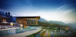 a building with a pool in the middle of a field