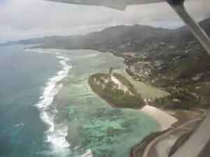 an aerial view of a beach and land