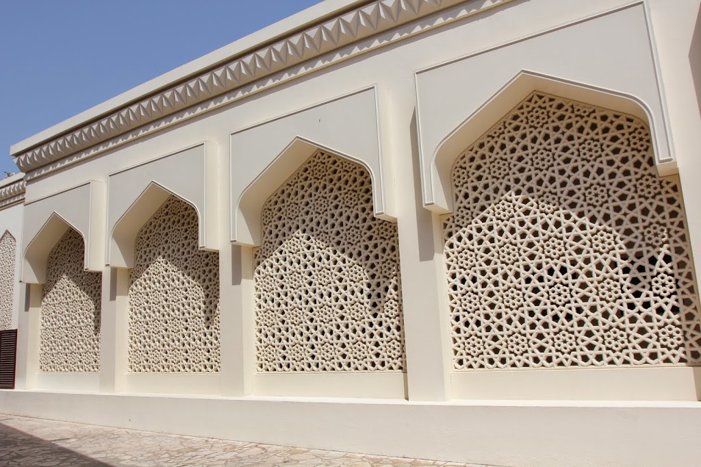 a white wall with carved designs