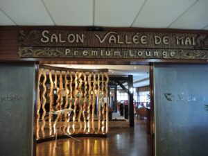 a sign with a wooden curtain