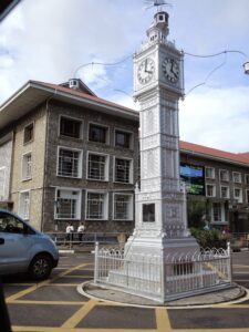 a large clock tower in front of a building