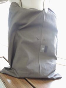 a grey bag with a logo on it