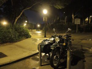 a motorcycle parked on a sidewalk