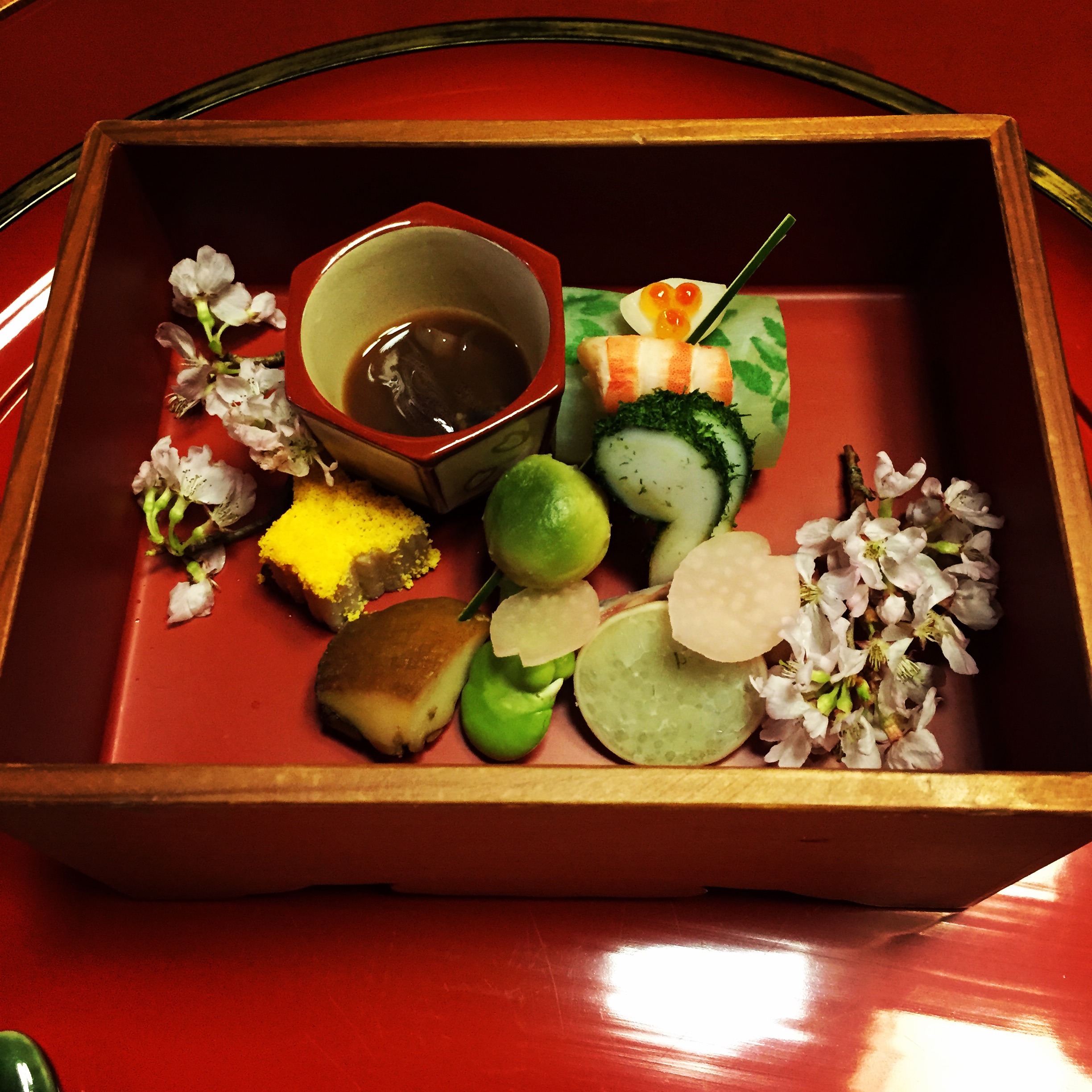a tray of food on a red surface