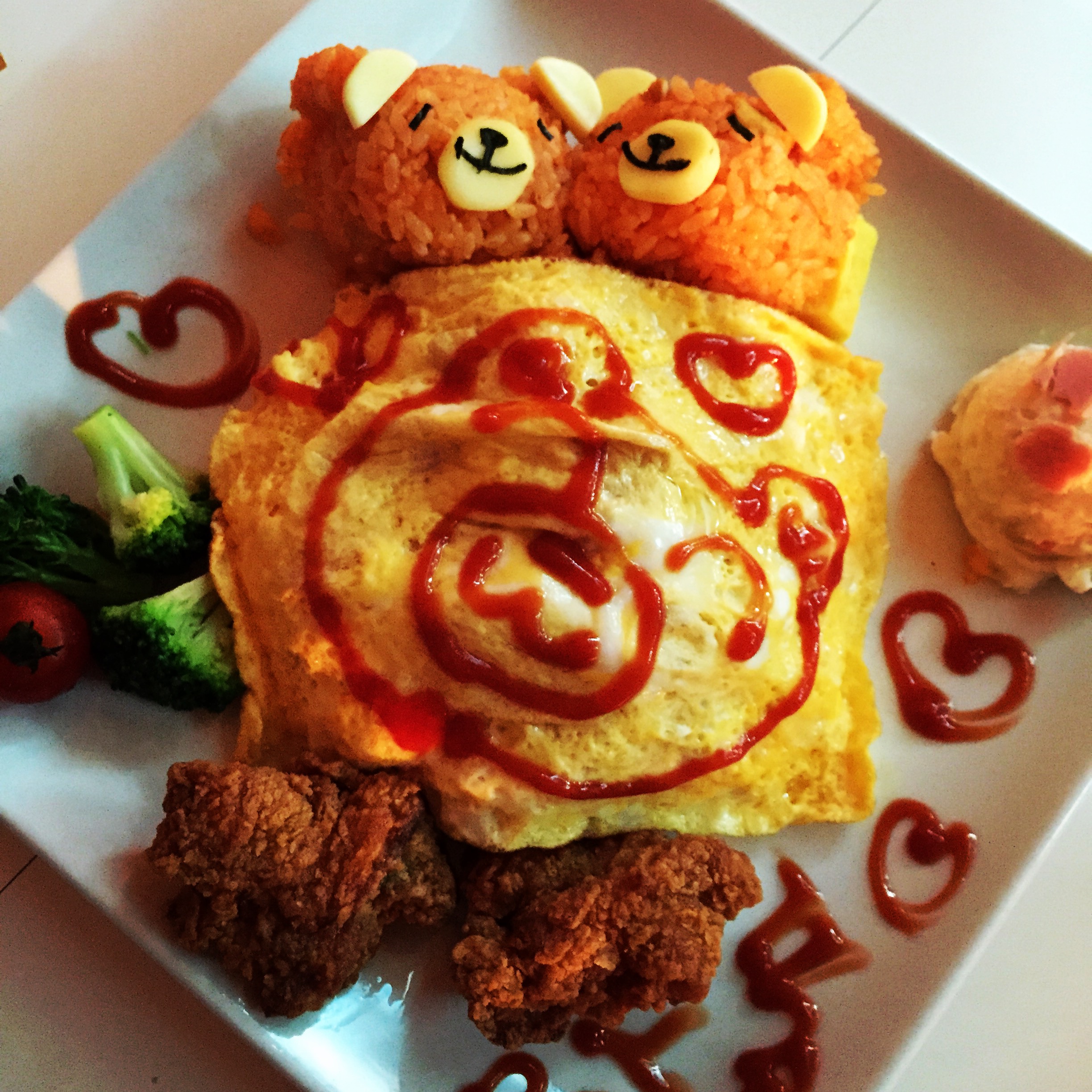 a plate of food with a bear made of food