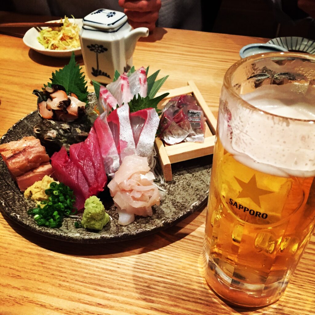 sashimi and sapporo beer
