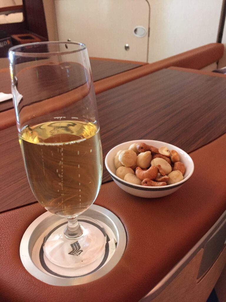 singapore airlines suites lax to nrt champagne nuts