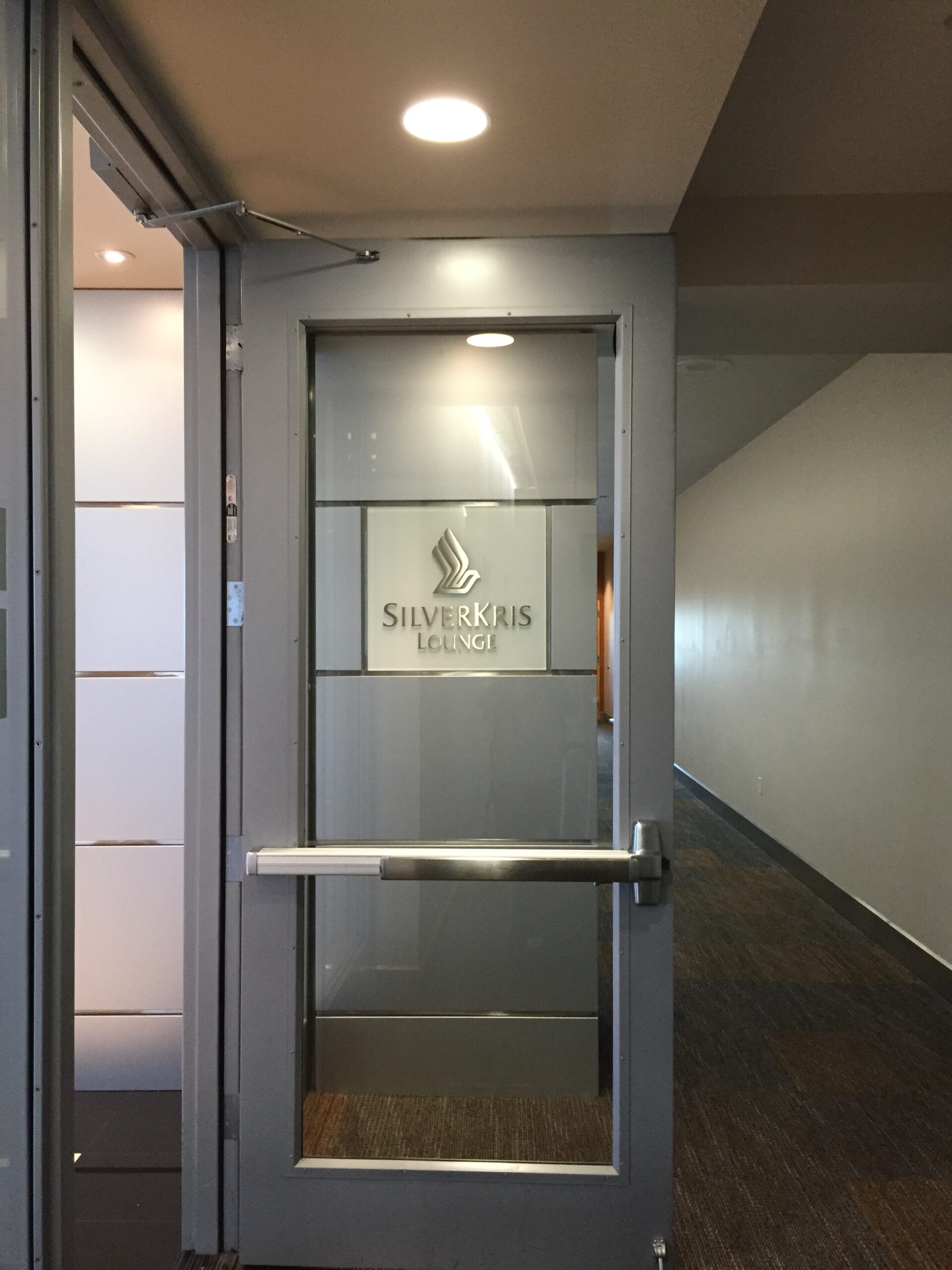 a glass door with a sign on it