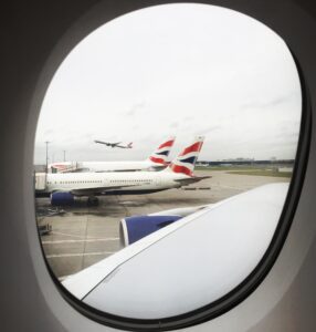 a plane in the window of an airplane