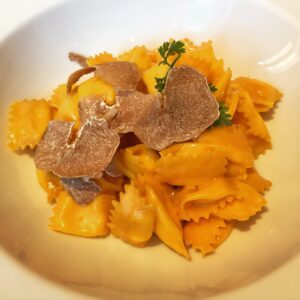 a bowl of pasta with mushrooms