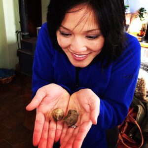 a woman holding two brown objects