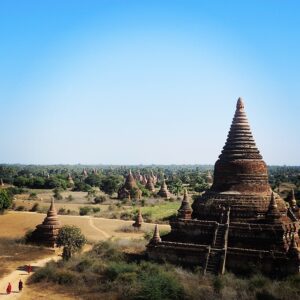 a group of ancient buildings in a field