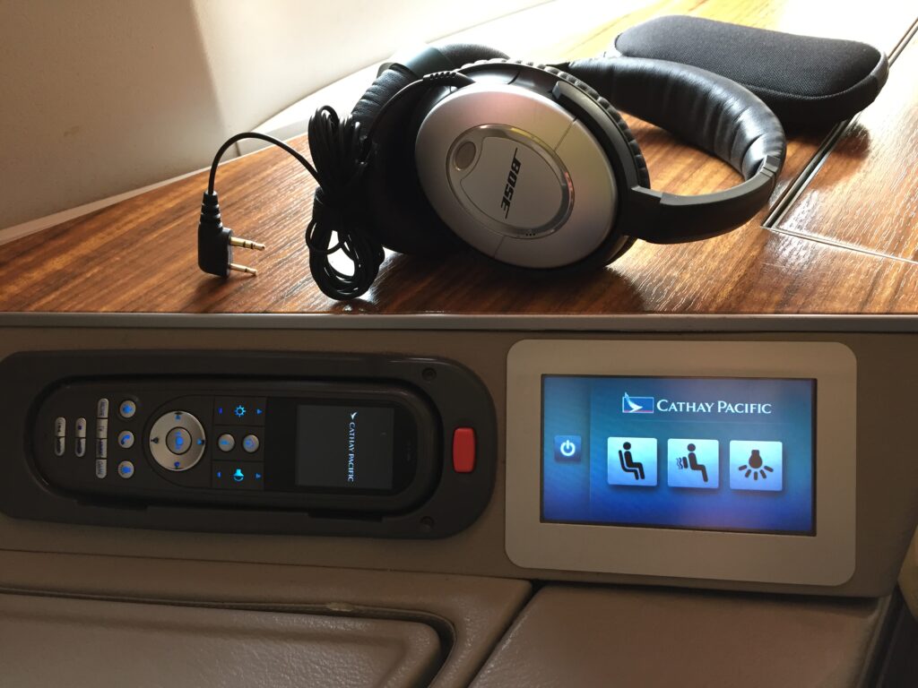 cathay pacific first class hong kong to new york bose headphones controls