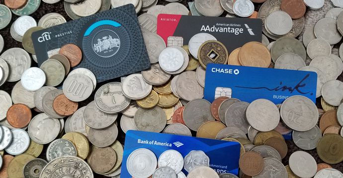 a pile of coins and credit cards