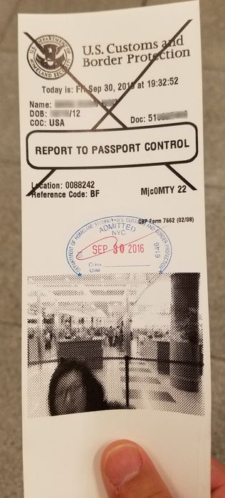 a passport control card with a stamp